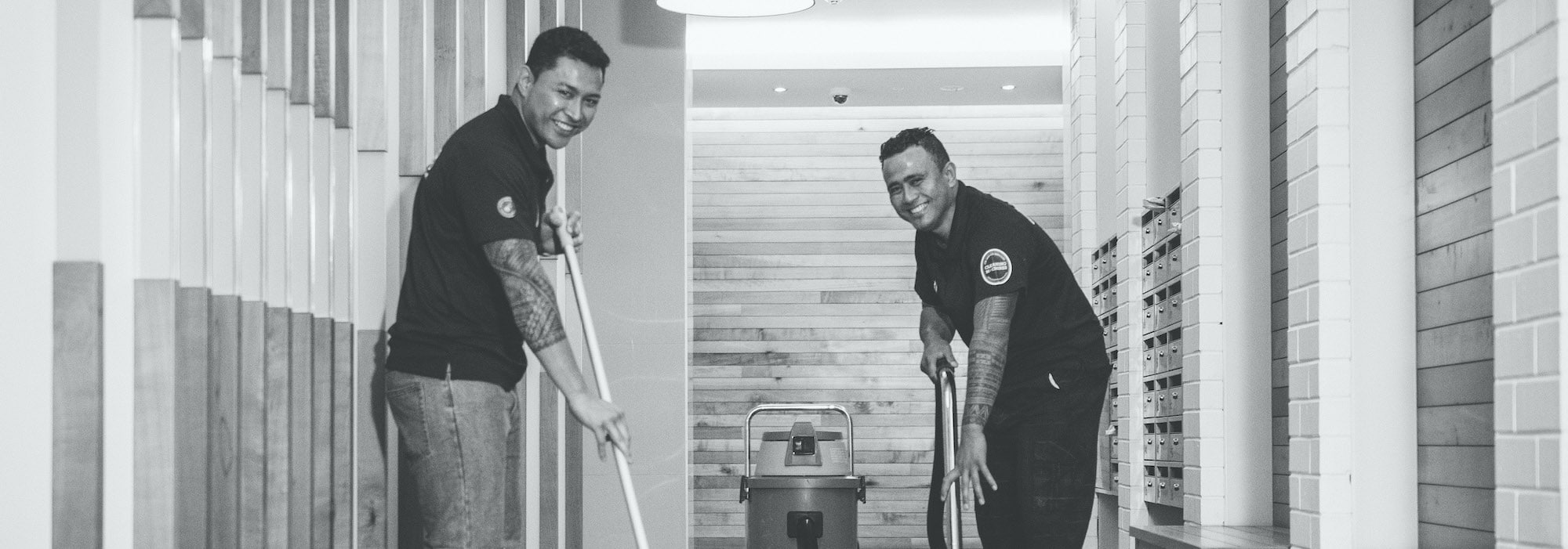 Two CMOS team members common area cleaning