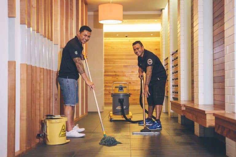 CMOS team members cleaning a site